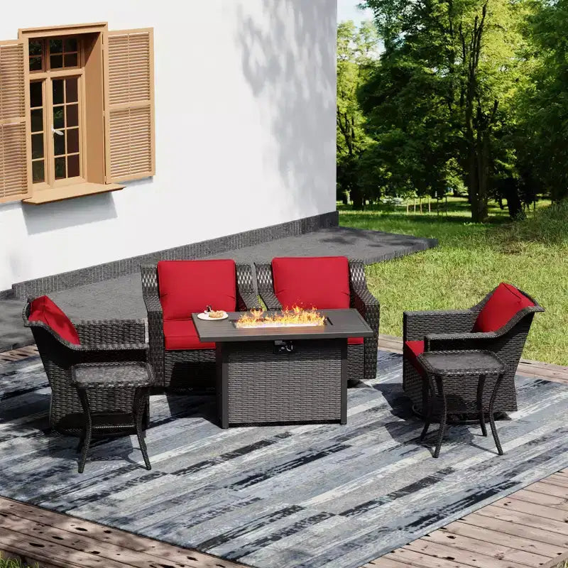 Ensemble de détente extérieur UPTIOT : 4 fauteuils à bascule, deux tables basses et un foyer multifonction
